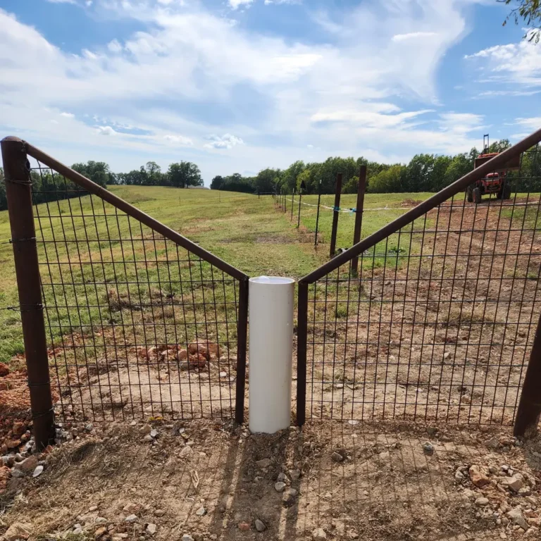 Drinking Post waterer installed at fence line serving two paddocks